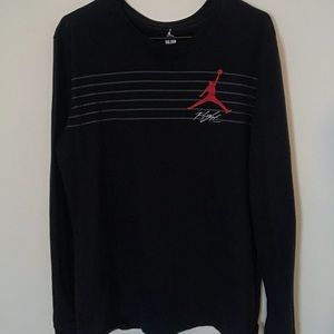 I’m selling a red and black Jordan Flight shirt.
